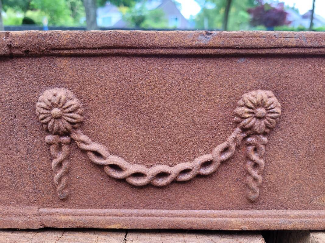 Rusty cast iron jardiniere planter