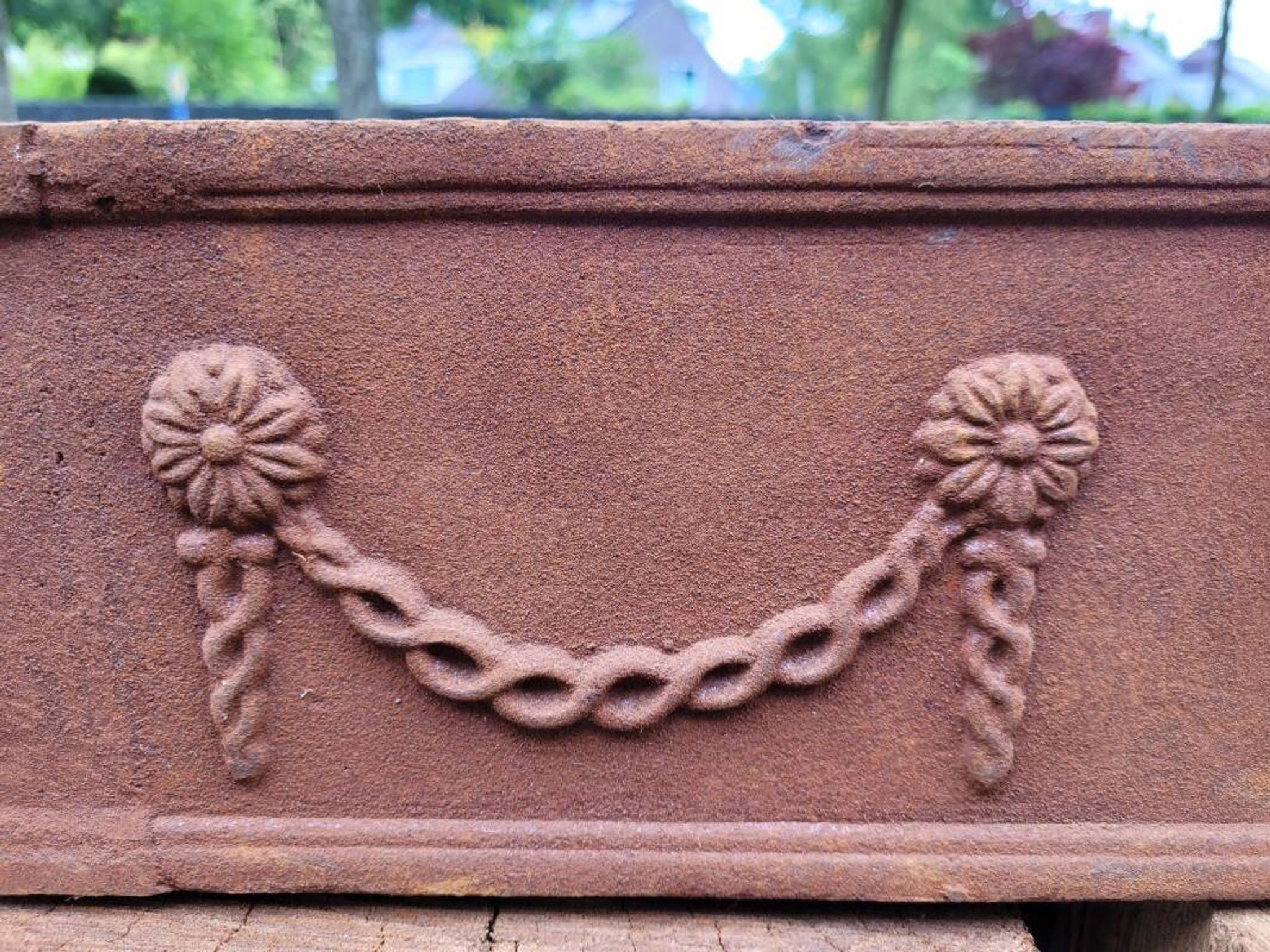 Rusty cast iron jardiniere planter