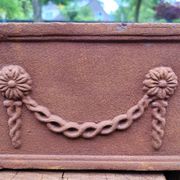 Rusty cast iron jardiniere planter