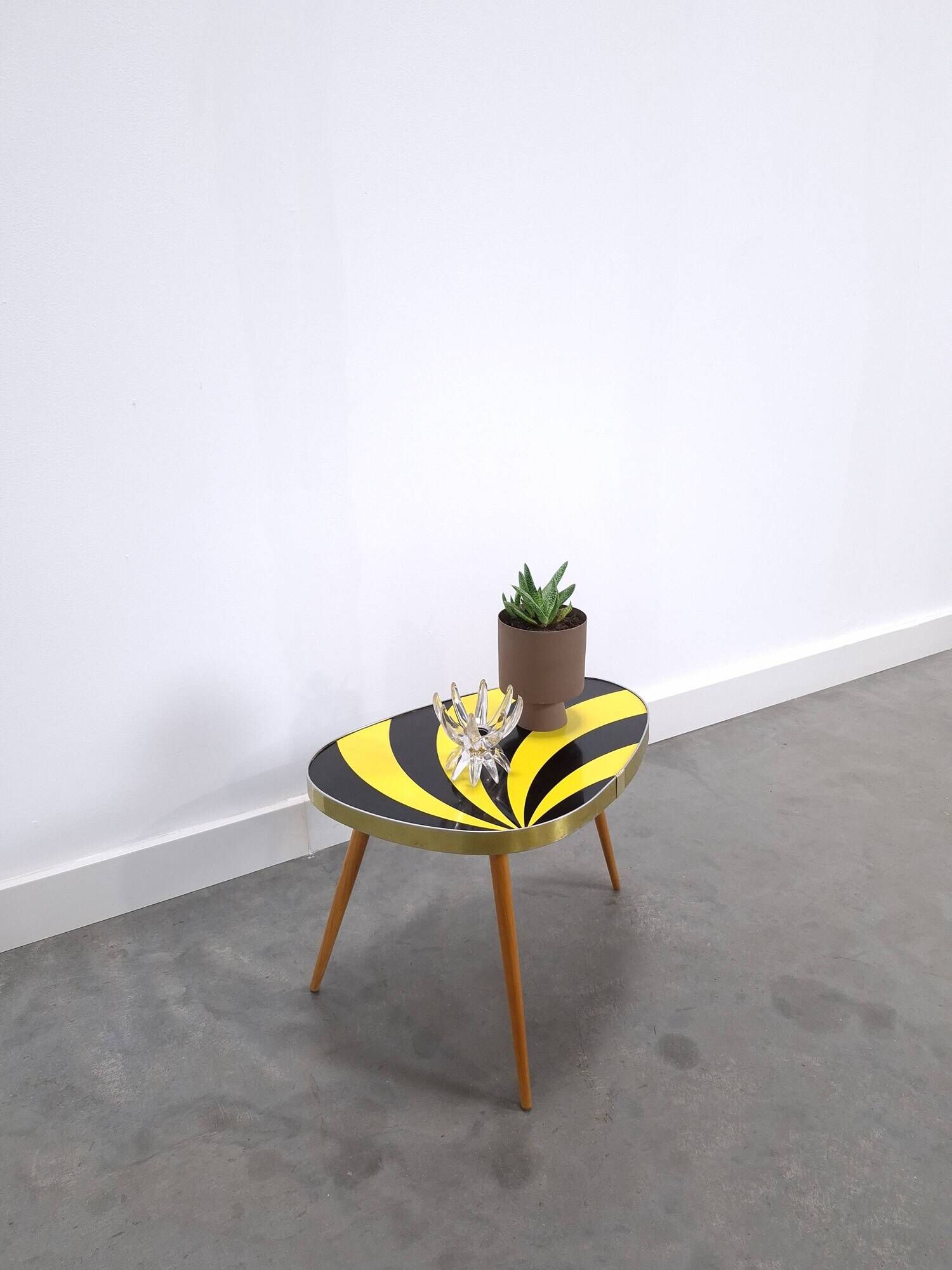 Vintage 1950s black and yellow striped formica table, plant table.