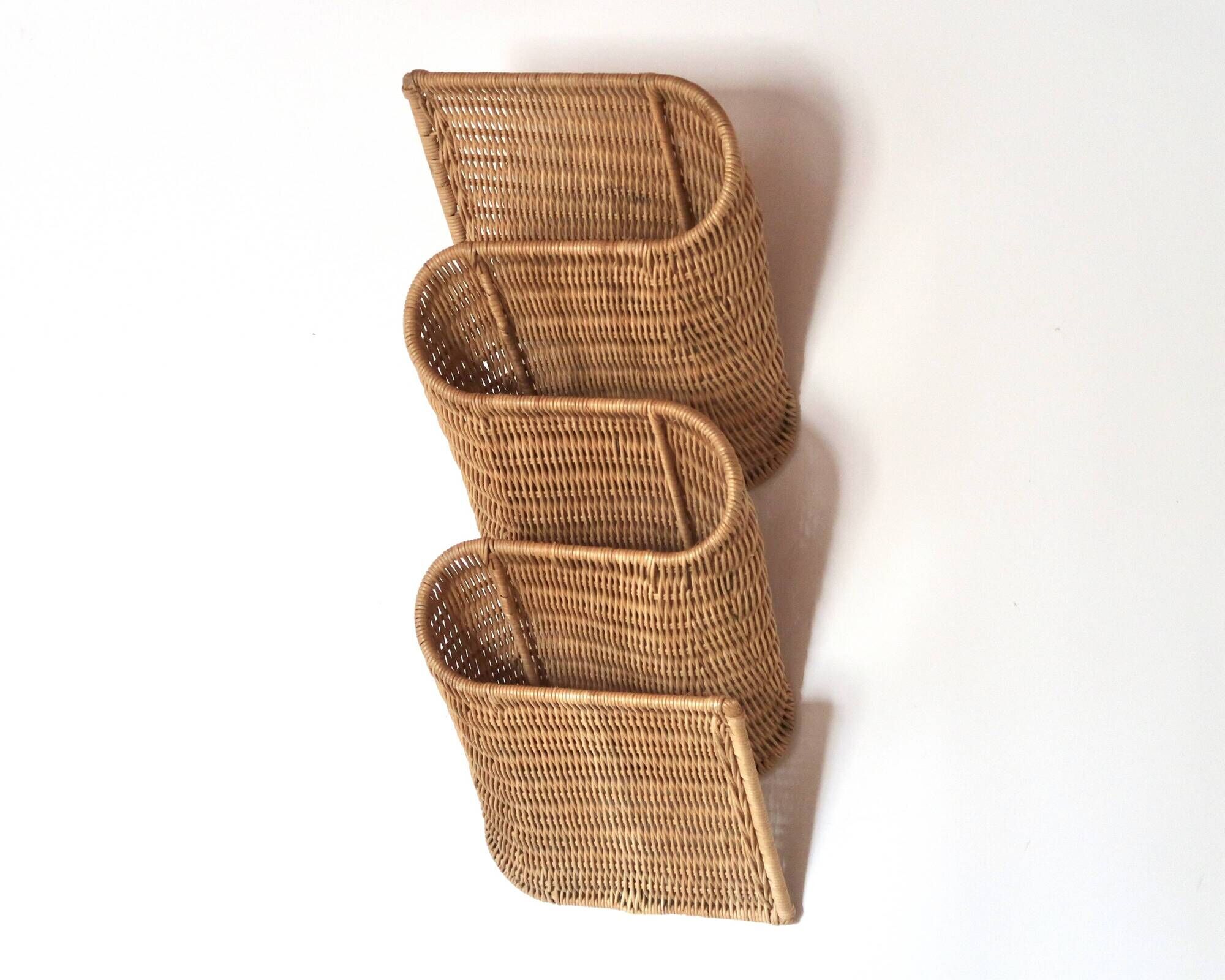 Wall-mounted magazine rack TIBY in rattan wicker by Karl Malmvall for Ikea from the 90s.