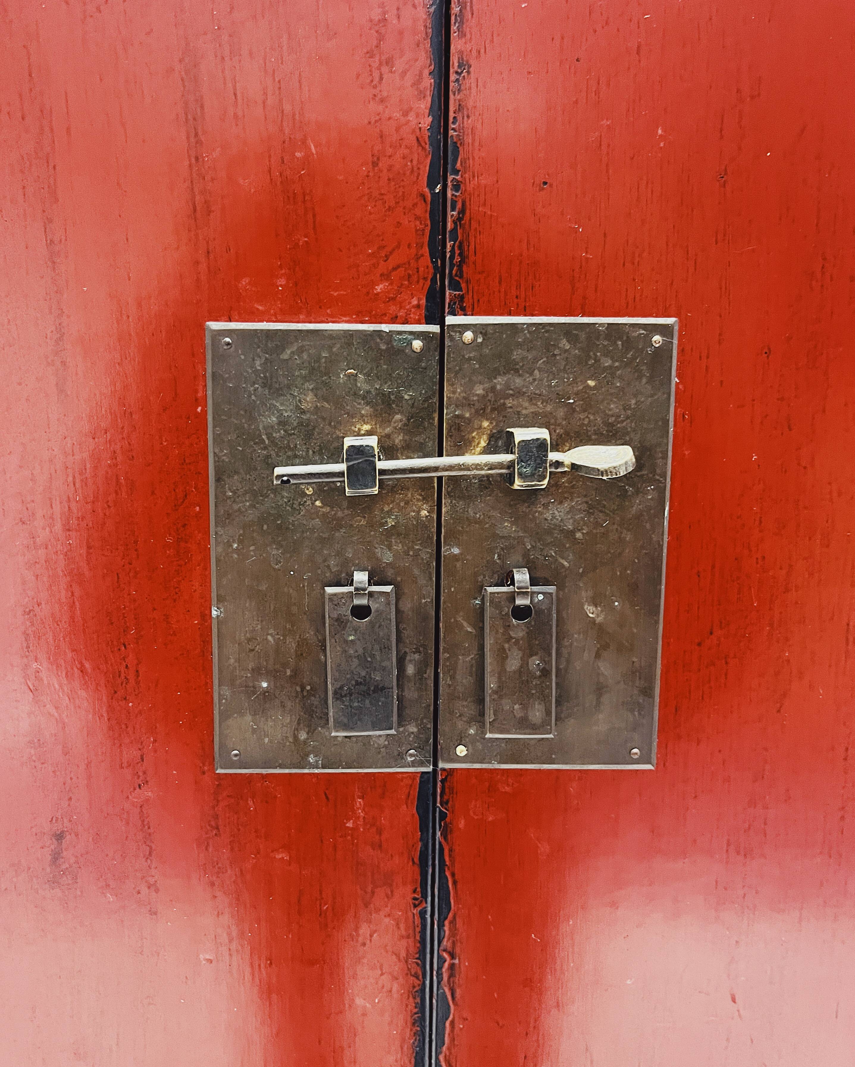 Red Chinese cabinet with three doors