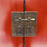 Red Chinese cabinet with three doors