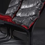 Vintage Siesta armchair and ottoman in black leather with red backrest by Ingmar Relling
