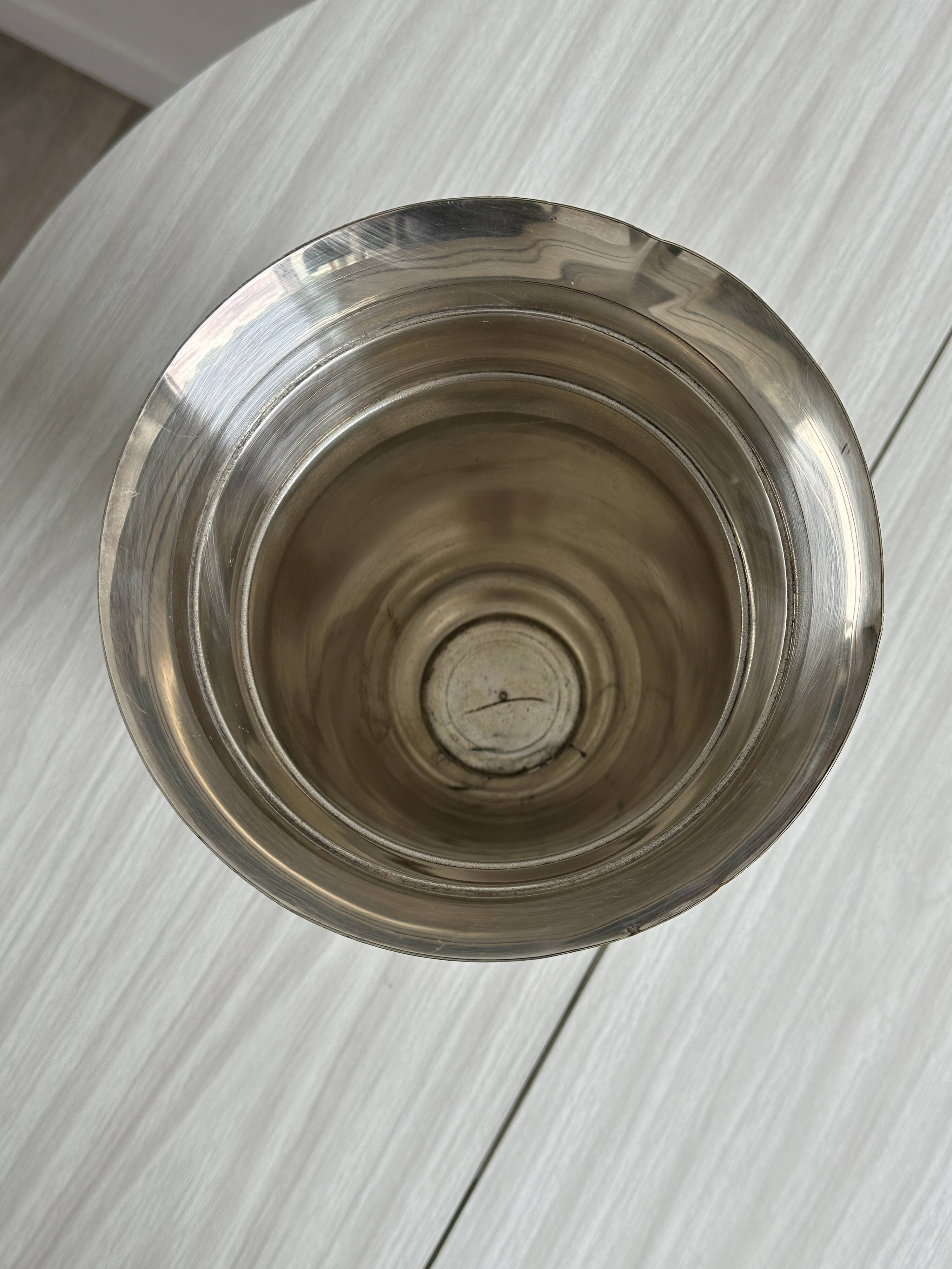 Antique shiny metal vase