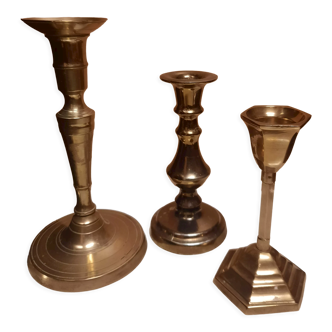 Trio of bronze candle holders