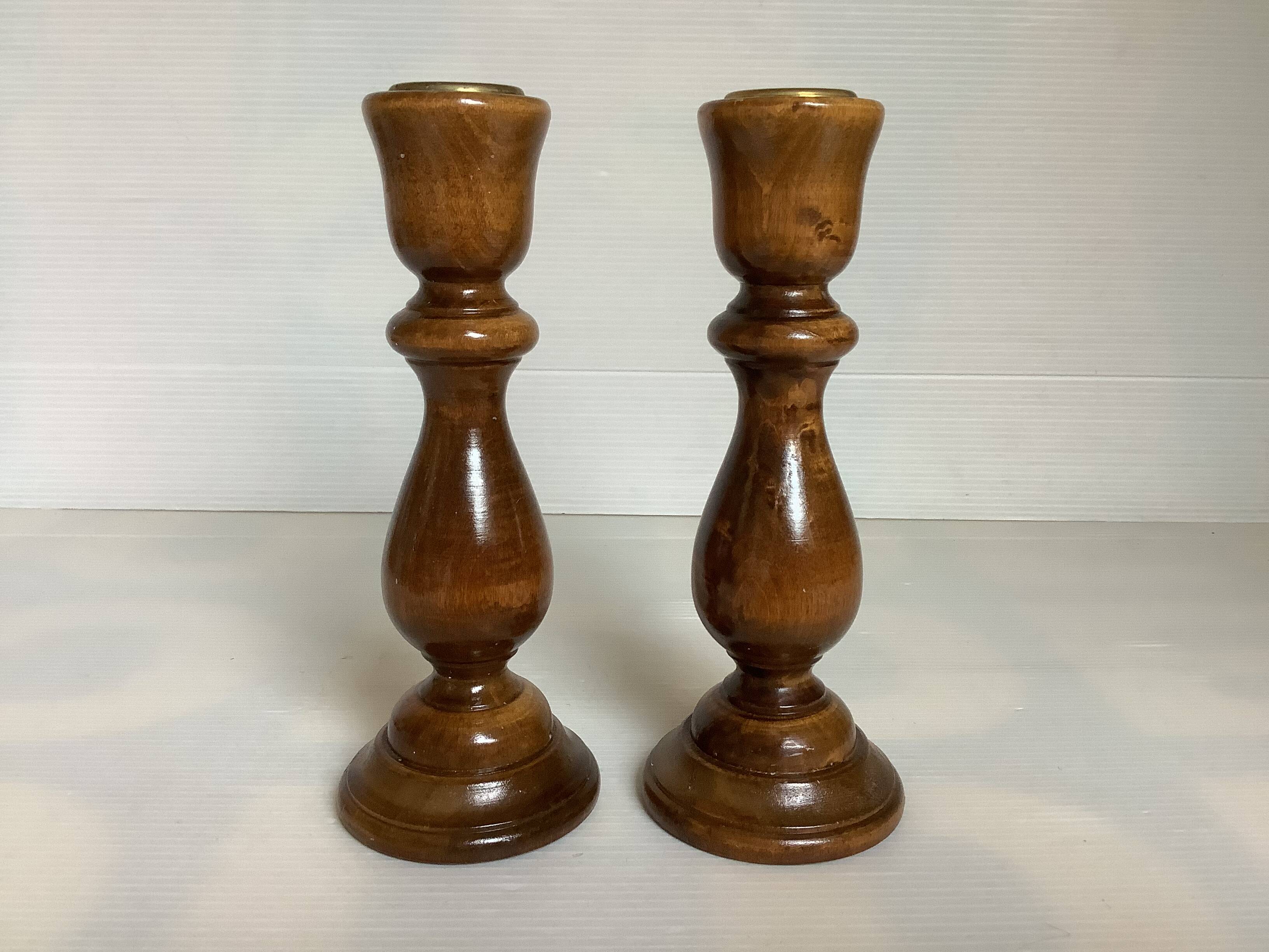 Pair of varnished wooden candlesticks