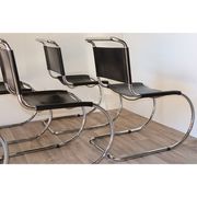 Series of 6 minimalist chairs in chrome metal and black leather around 1970