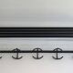 Designer coat rack in blackened metal