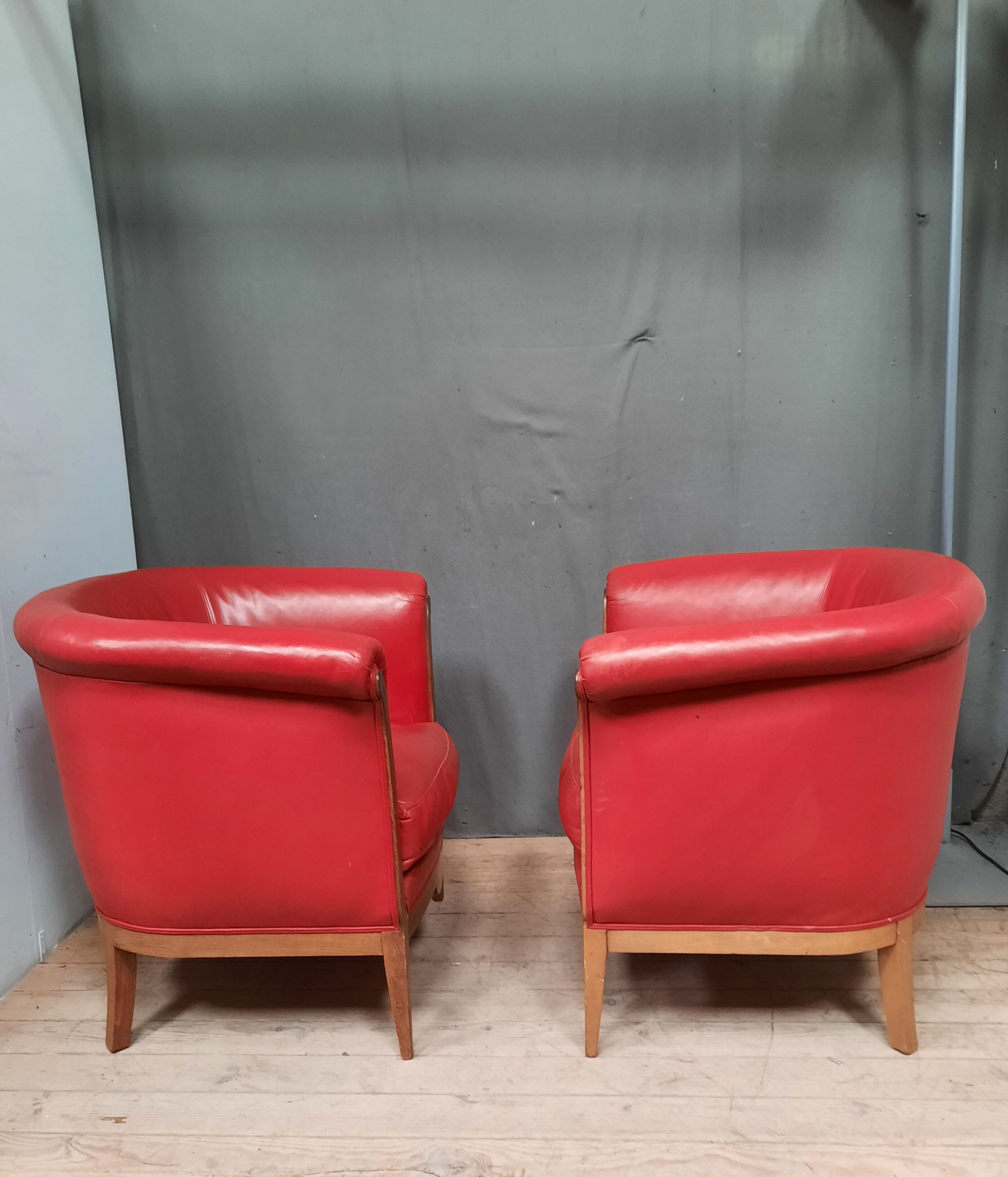 Pair of red leather armchairs