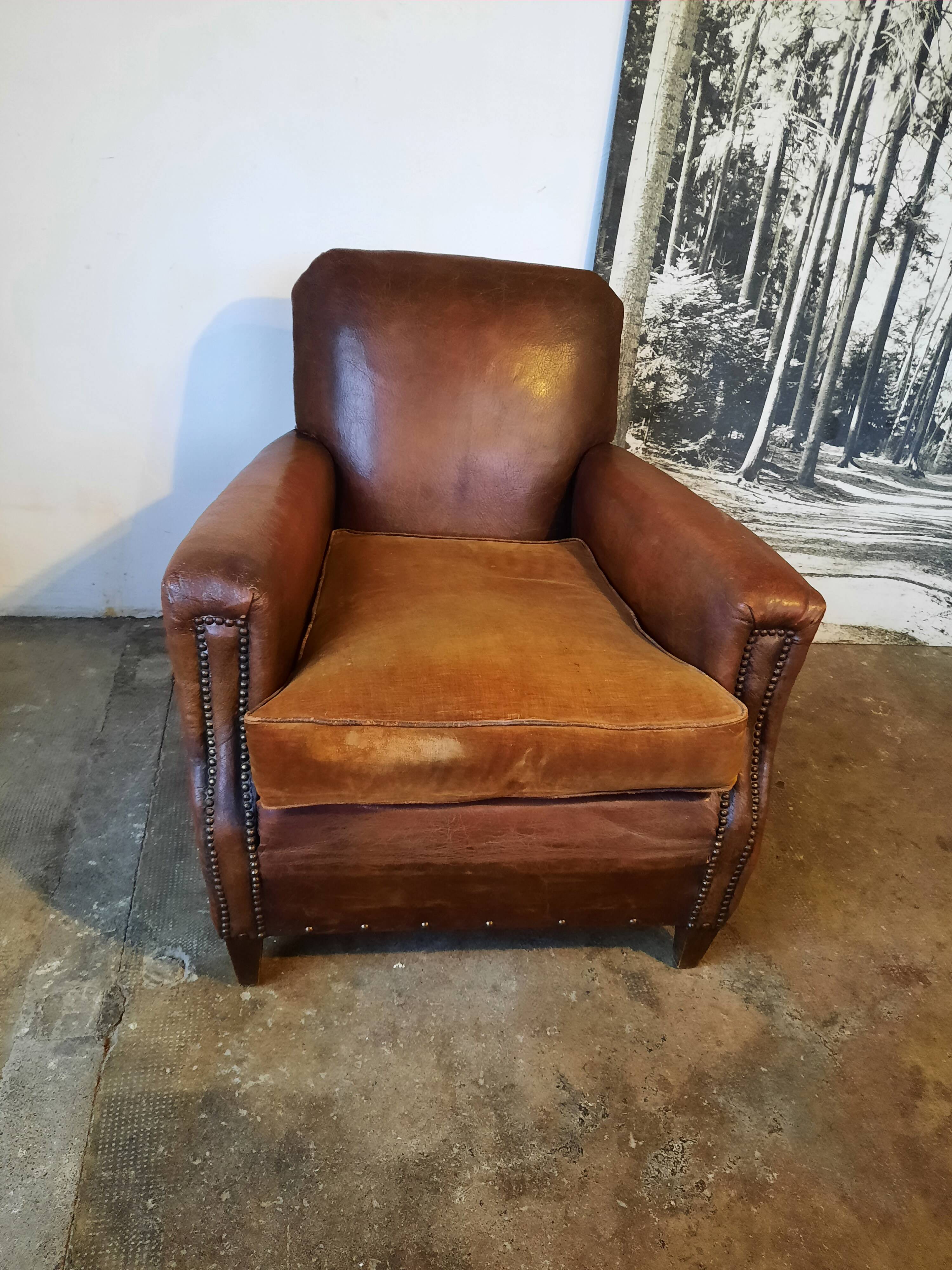 Old studded leather club chair 1930-1930