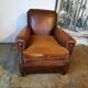 Old studded leather club chair 1930-1930