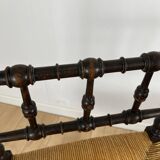 Corner chair in carved wood and straw, late 19th century.