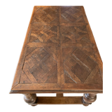 Old dining table with parquet floors