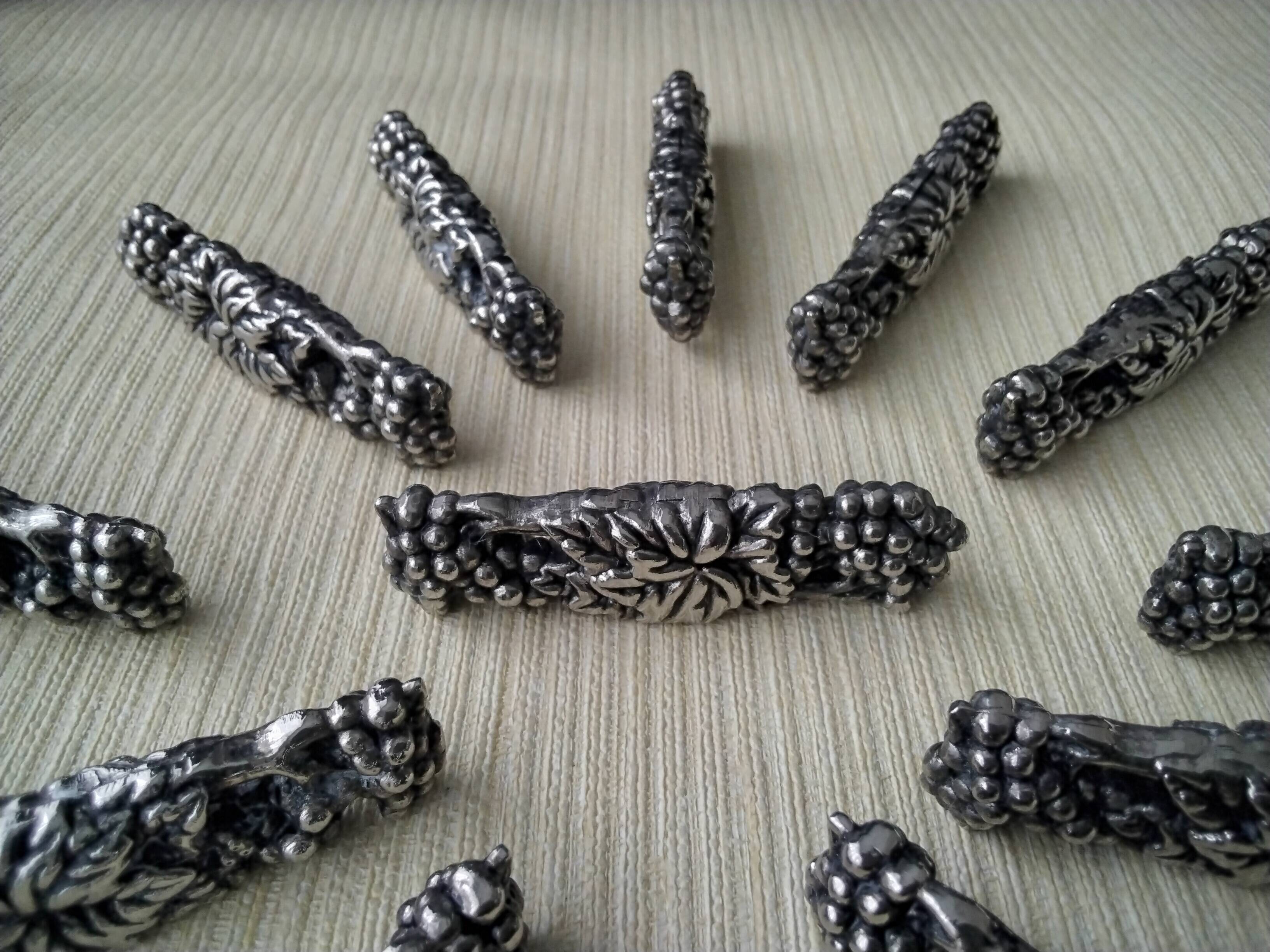 12 Metal knife holders with bunches of grapes and vine leaves
