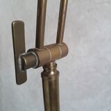 Articulated brass floor lamp