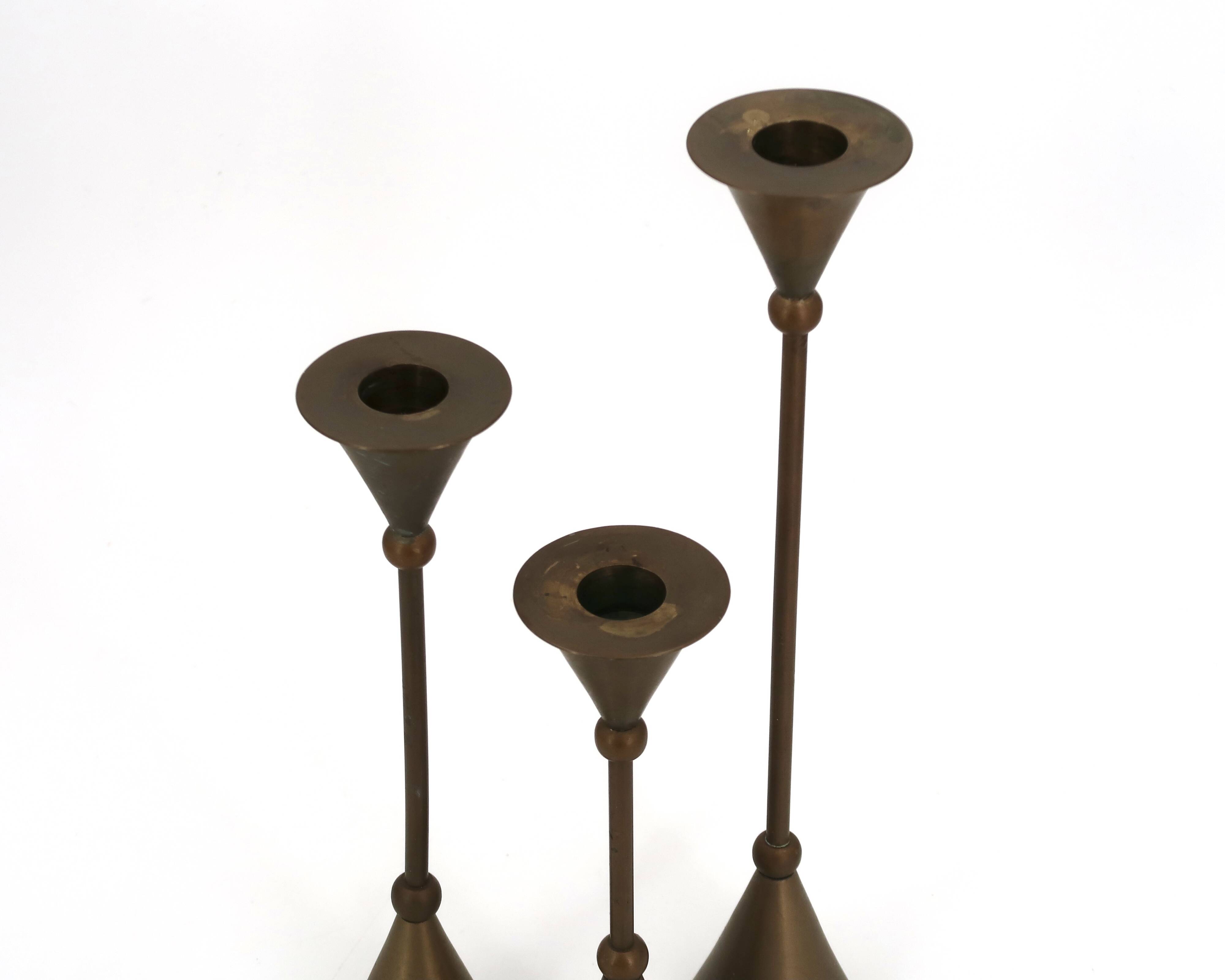 Brass candle holder trio by Christian de Beaumont, 1970s.