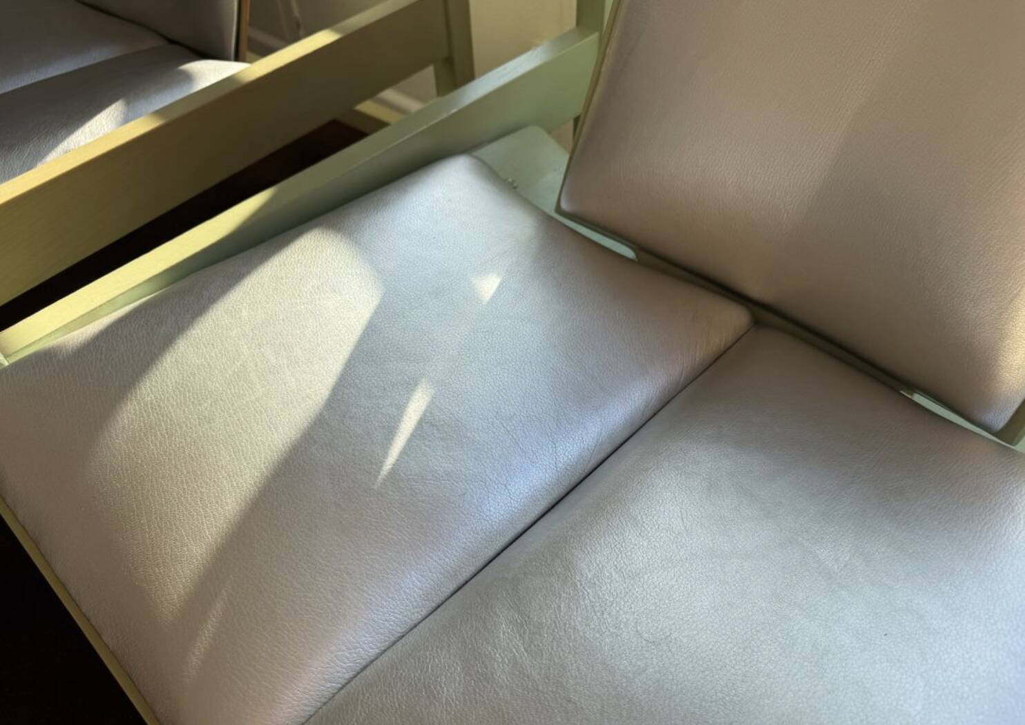 Pair of Argos armchairs by Baumann in green and silver leather.