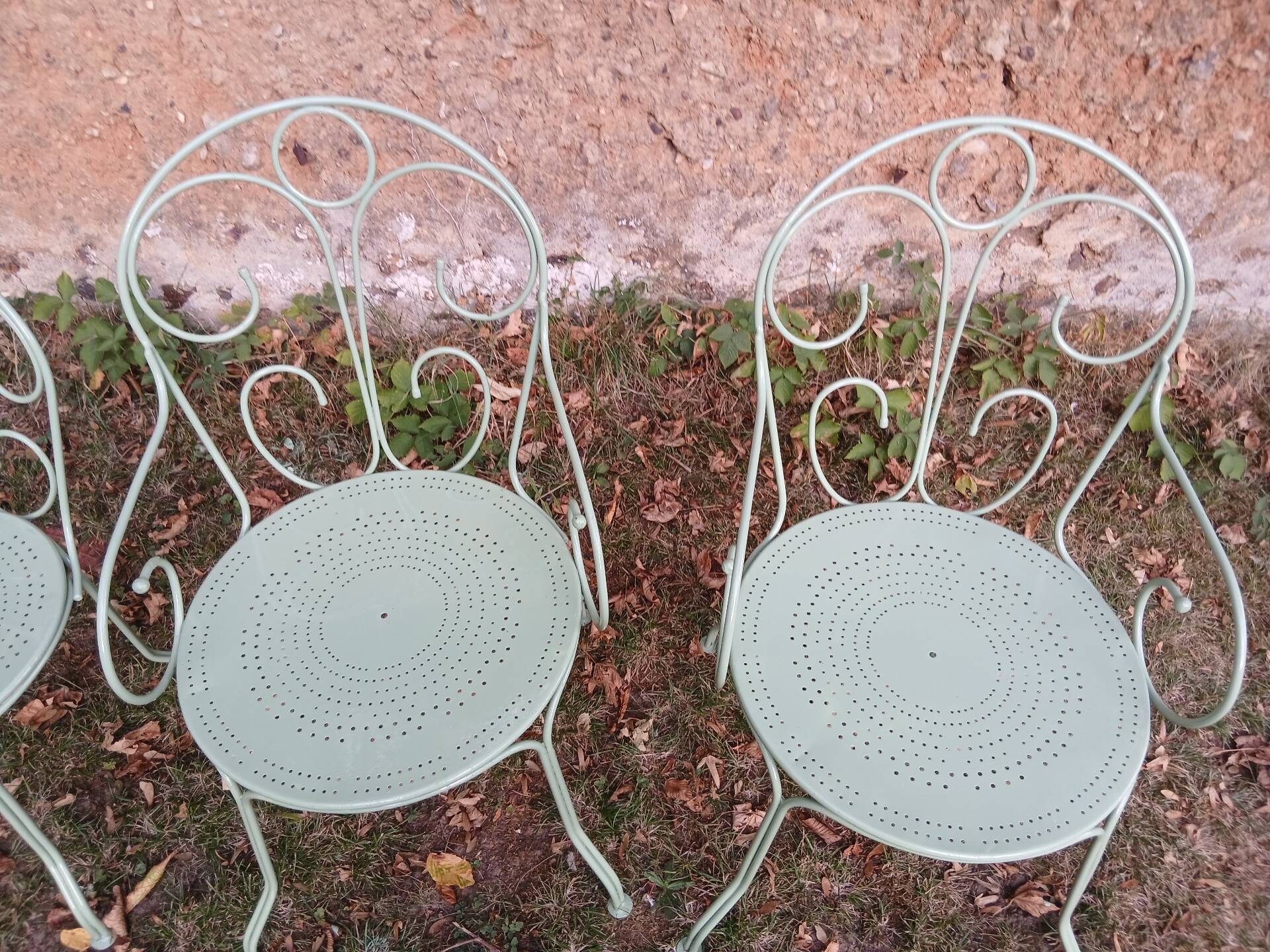 Garden furniture set with 1 table, 2 armchairs, and 2 chairs in antique green wrought iron.
