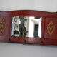 Red wooden wall-mounted coat rack and Art Deco mirror