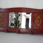 Red wooden wall-mounted coat rack and Art Deco mirror