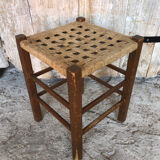 Wooden stool with woven rope seat