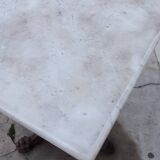 Bistro pedestal table in marble and cast iron lion paws