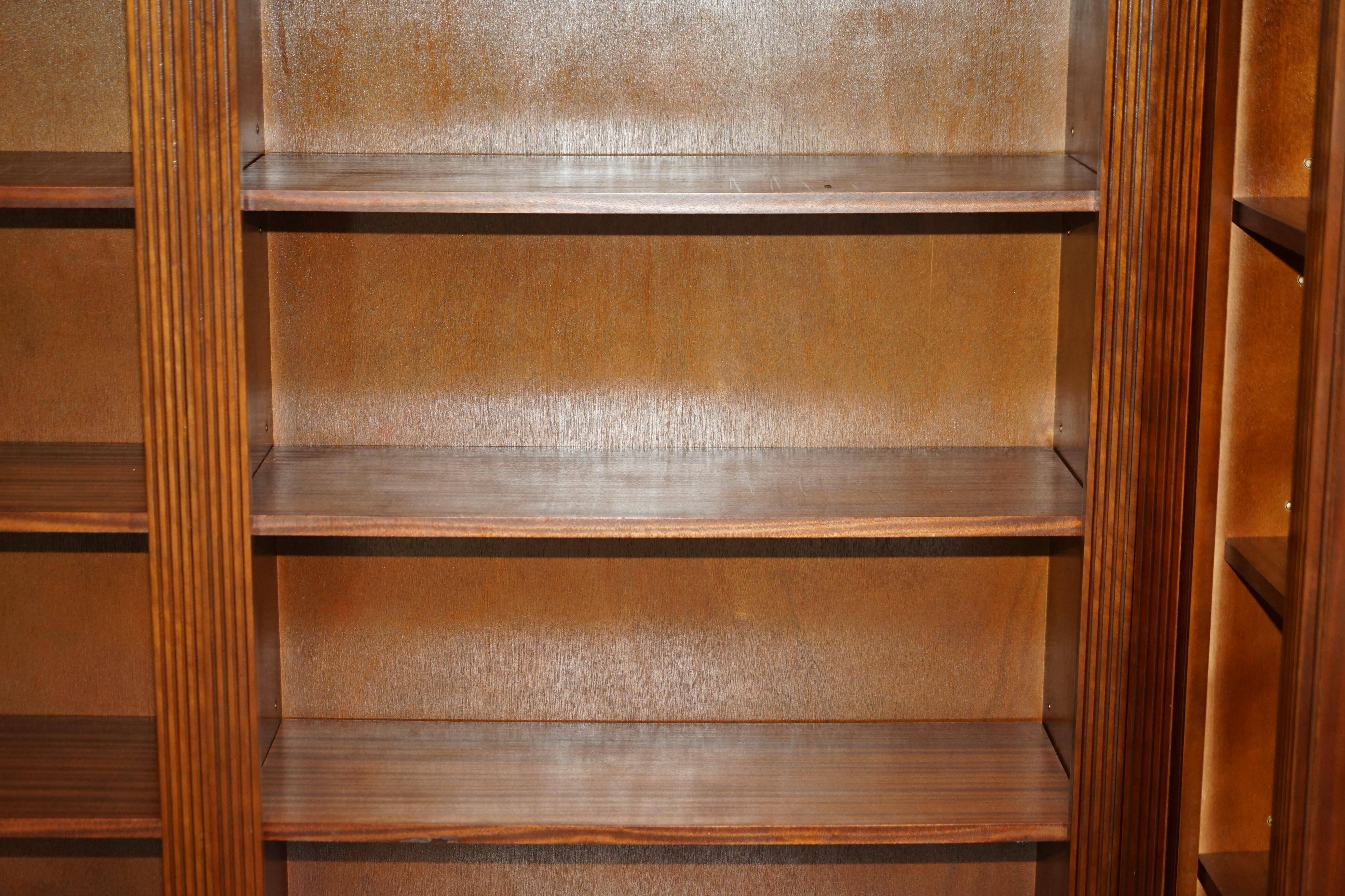 Corner library made of flamed hardwood, in 3 parts.