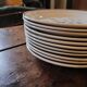 11 dinner plates decorated with stylized roses. 1950s. 11 dinner plates