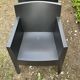 2 black Toy chairs designed by Starck