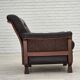 Fauteuil scandinave années 1970, cuir d'ameublement marron, pieds en bois de teck.