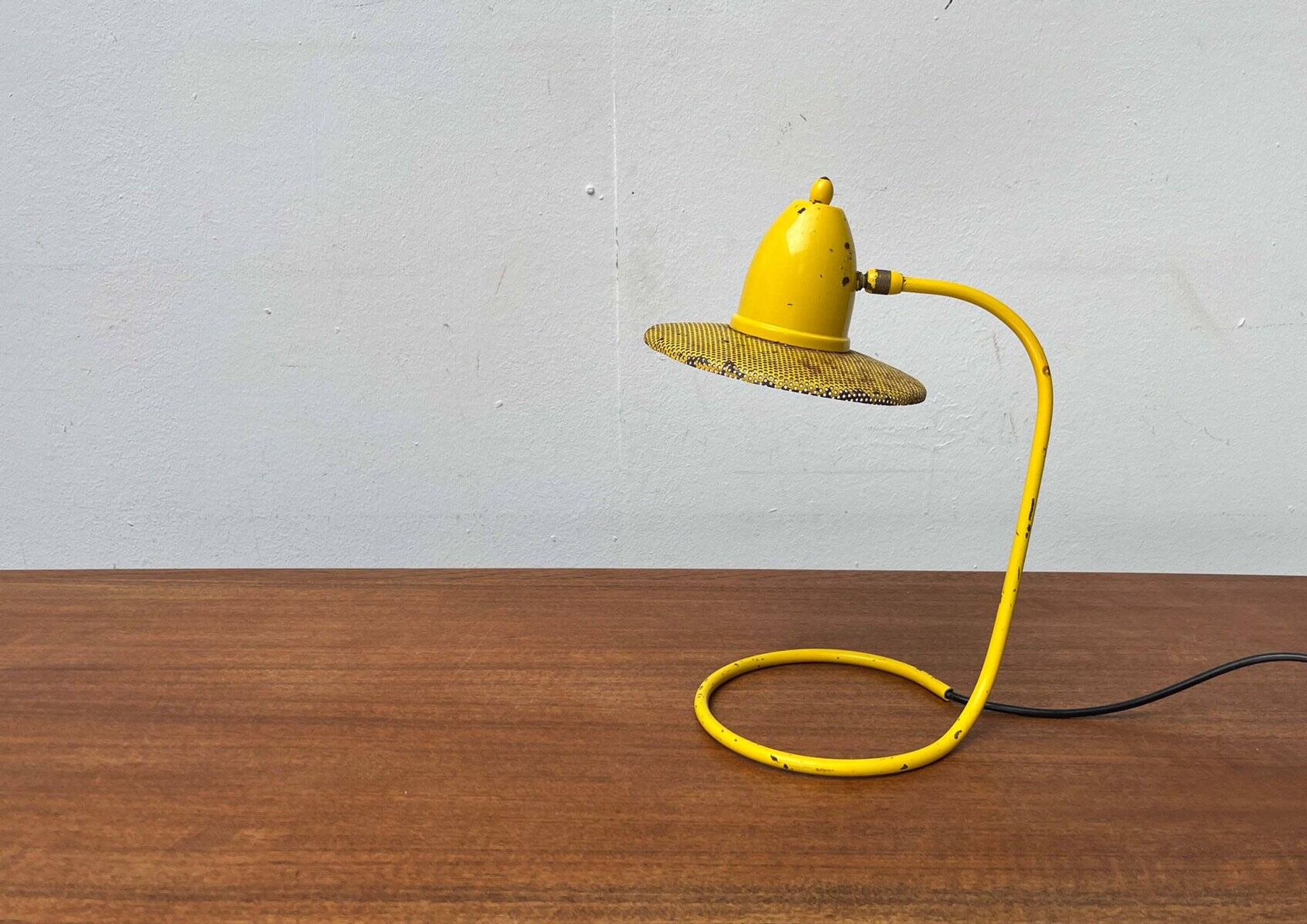 Perforated metal table lamp in Mid-Century Modern style, in the style of Mathieu Matégot, 1960s.