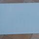 Long modern coffee table in glass and off-white metal - as new.