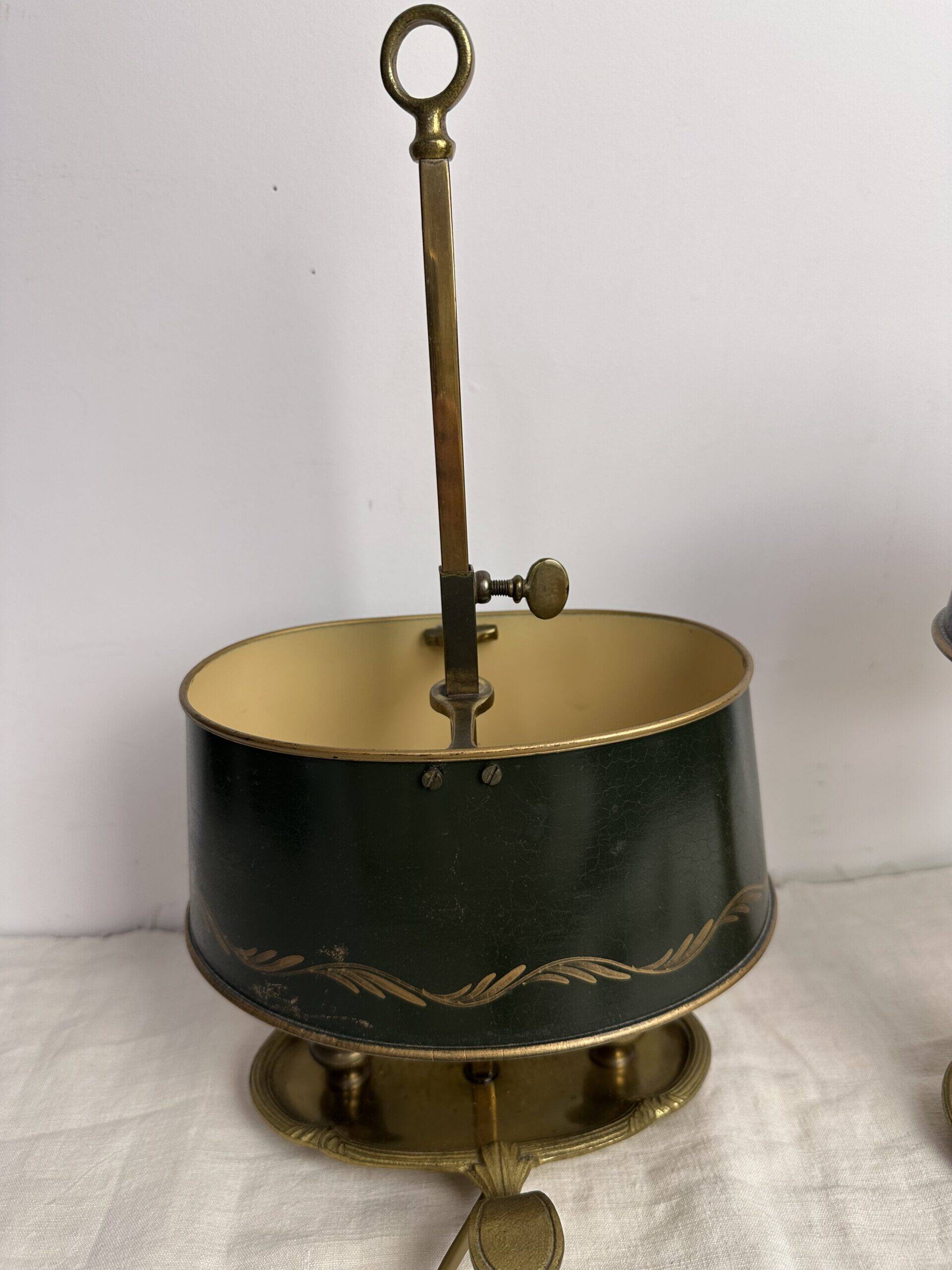 A pair of old brass bed warmers.
