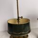 A pair of old brass bed warmers.