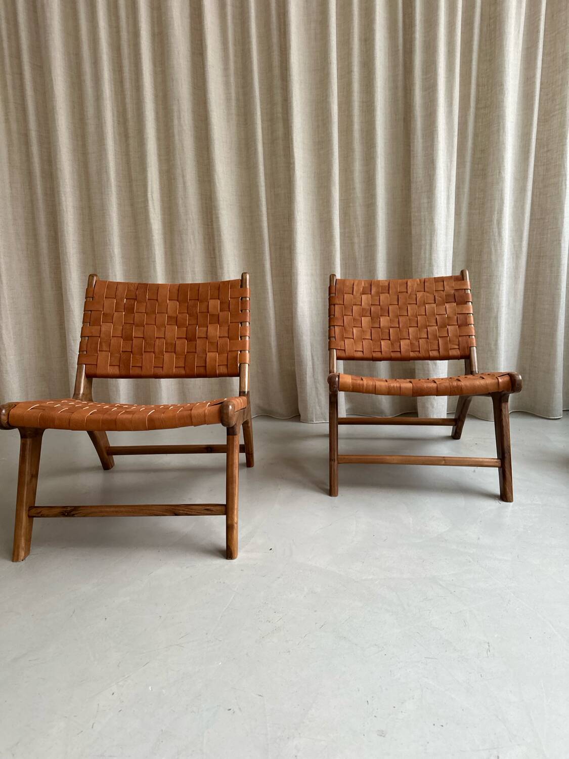 Pair of leather and walnut armchairs
