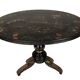 Large tilting pedestal table, black lacquered wood with a lively oriental landscape decoration.