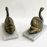 Swan bookends on marble