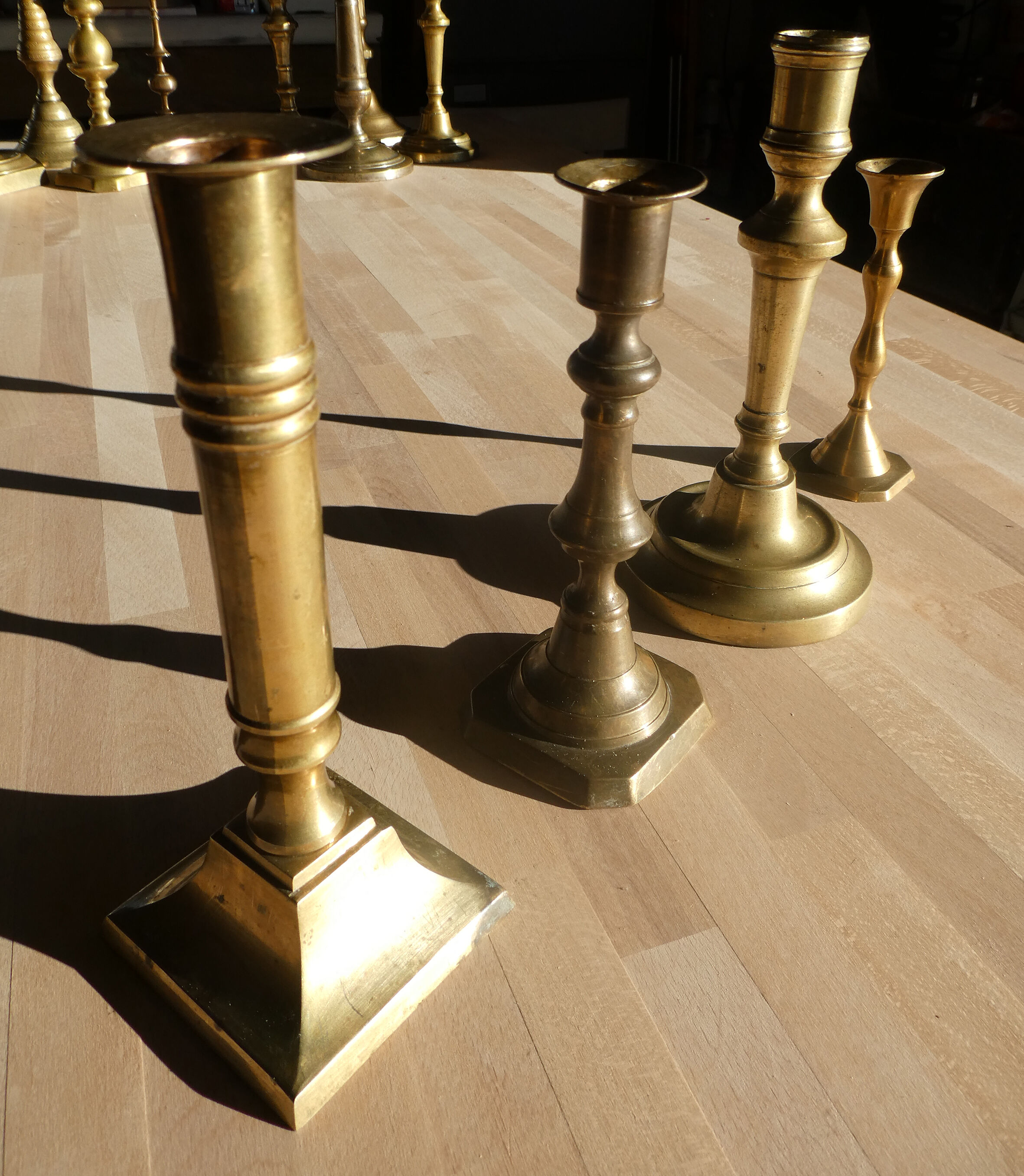 Set of 4 old candle holders in golden brass