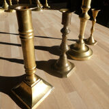 Set of 4 old candle holders in golden brass