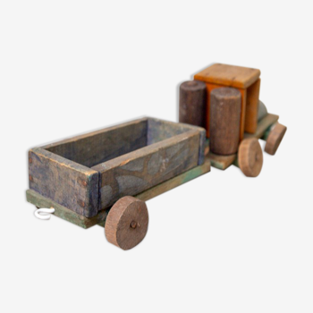 Old wooden train locomotive and toy trailer