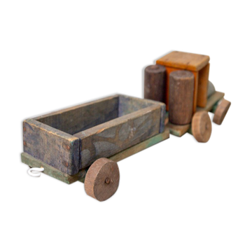 Old wooden train locomotive and toy trailer