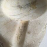 White marble ashtray with a raw appearance