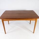 Dining table in teak with extentions and legs in oak, of danish design from the 1960s.
