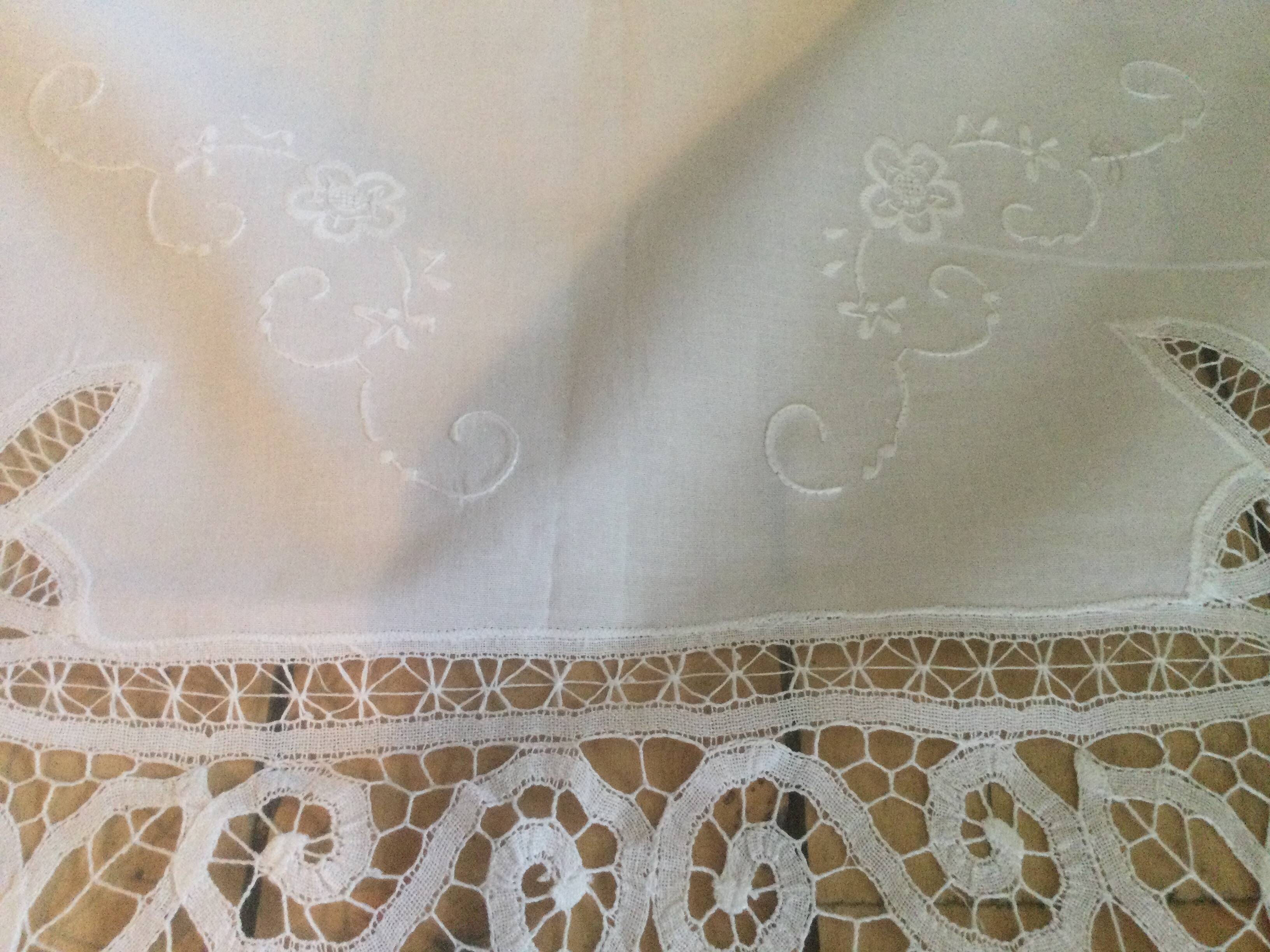 Embroidered white tablecloth and lace