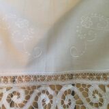 Embroidered white tablecloth and lace