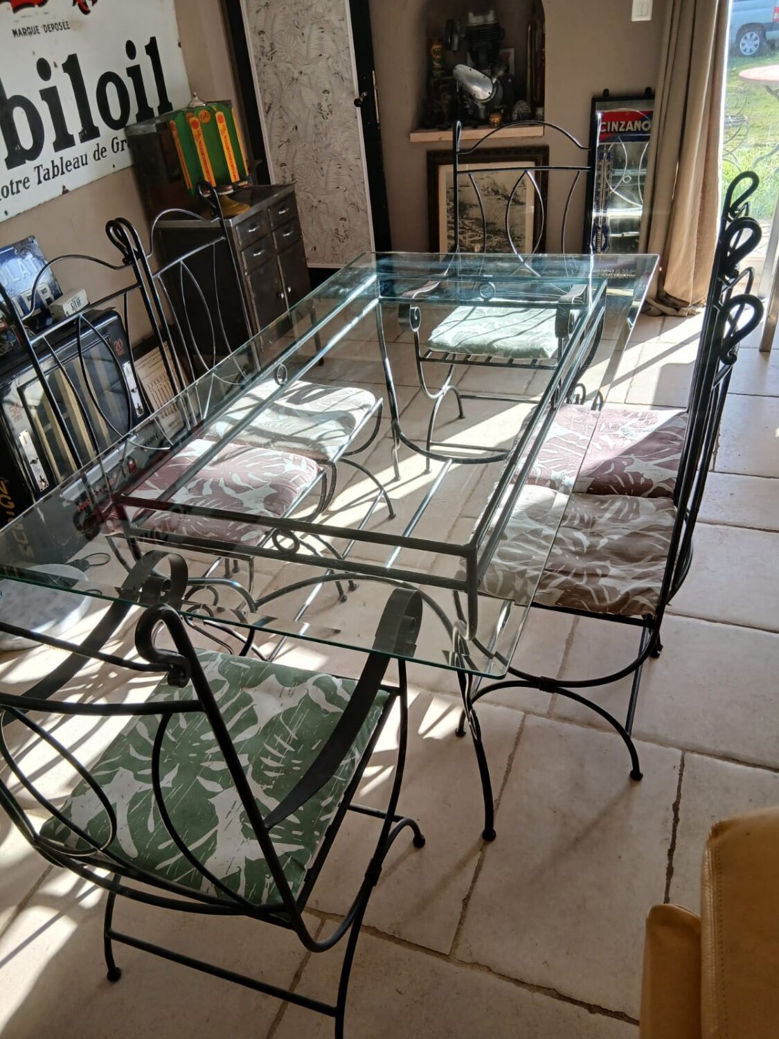 Glass table and wrought iron chairs