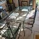 Glass table and wrought iron chairs