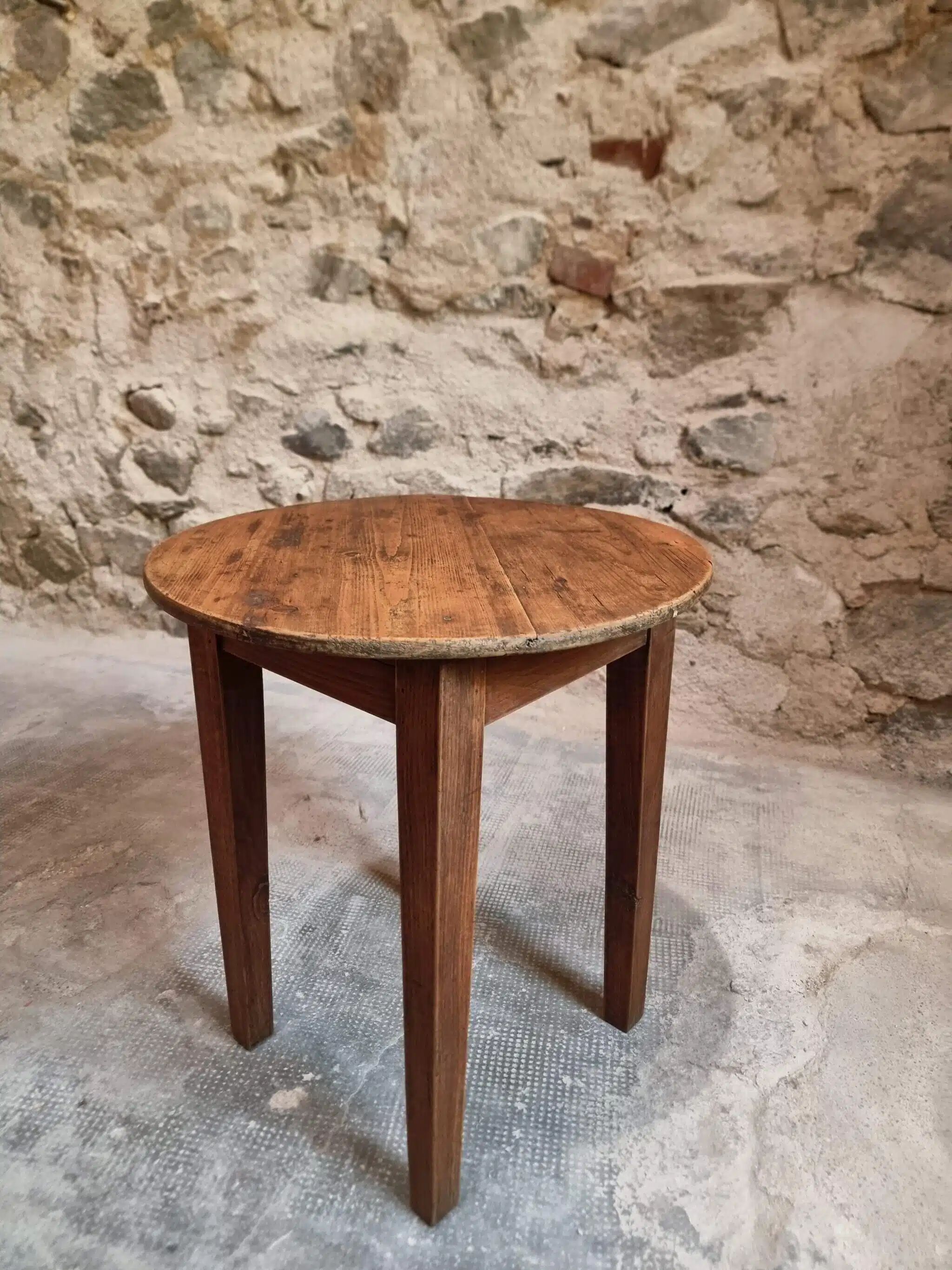 Antique round side table with oak legs and a pine top, circa 1900.