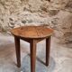 Antique round side table with oak legs and a pine top, circa 1900.